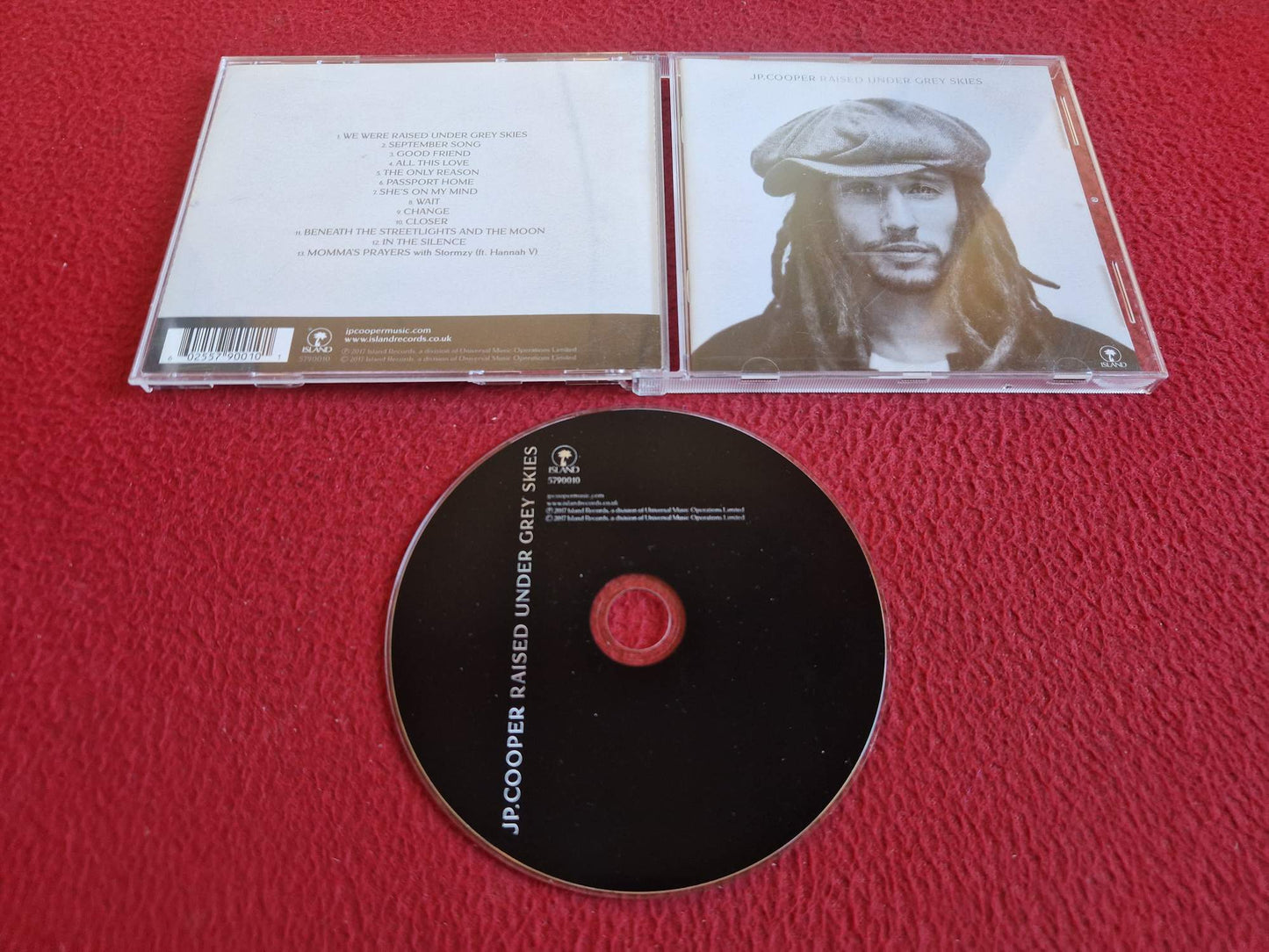 JP. COOPER RAISED UNDER GREY SKIES CD