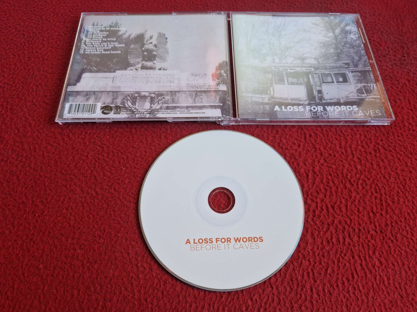 A LOSS FOR WORDS BEFORE IT CAVES CD