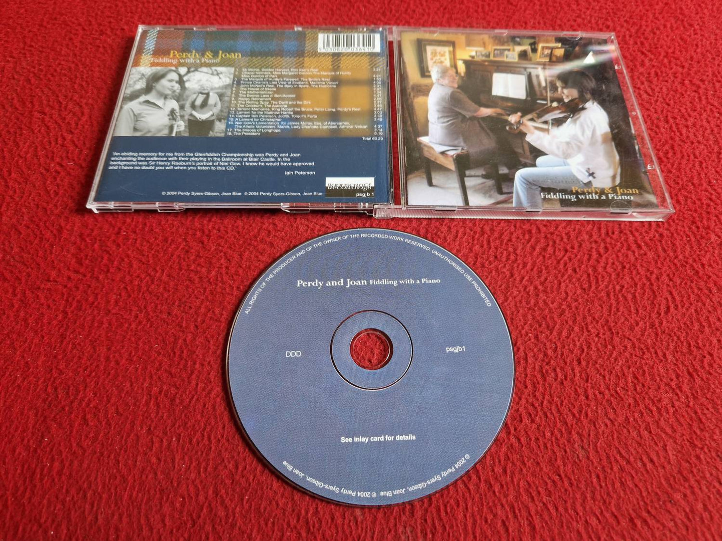 PERDY AND JOAN FIDDLING WITH A PIANO CD